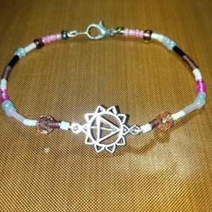 Beaded bracelet with charm